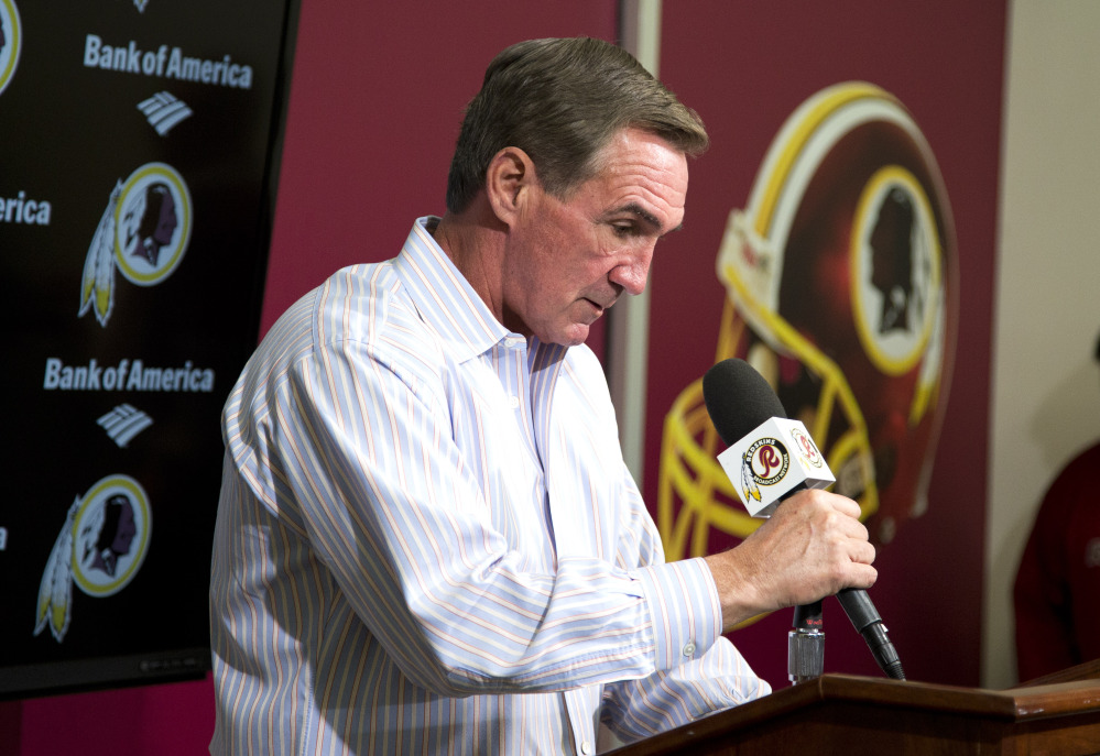 Former Washington Redskins coach Mike Shanahan delivers a statement after he was fired Monday at Redskins Park, in Ashburn, Va. Shanahan was let go after a morning meeting with owner Dan Snyder and general manager Bruce Allen.