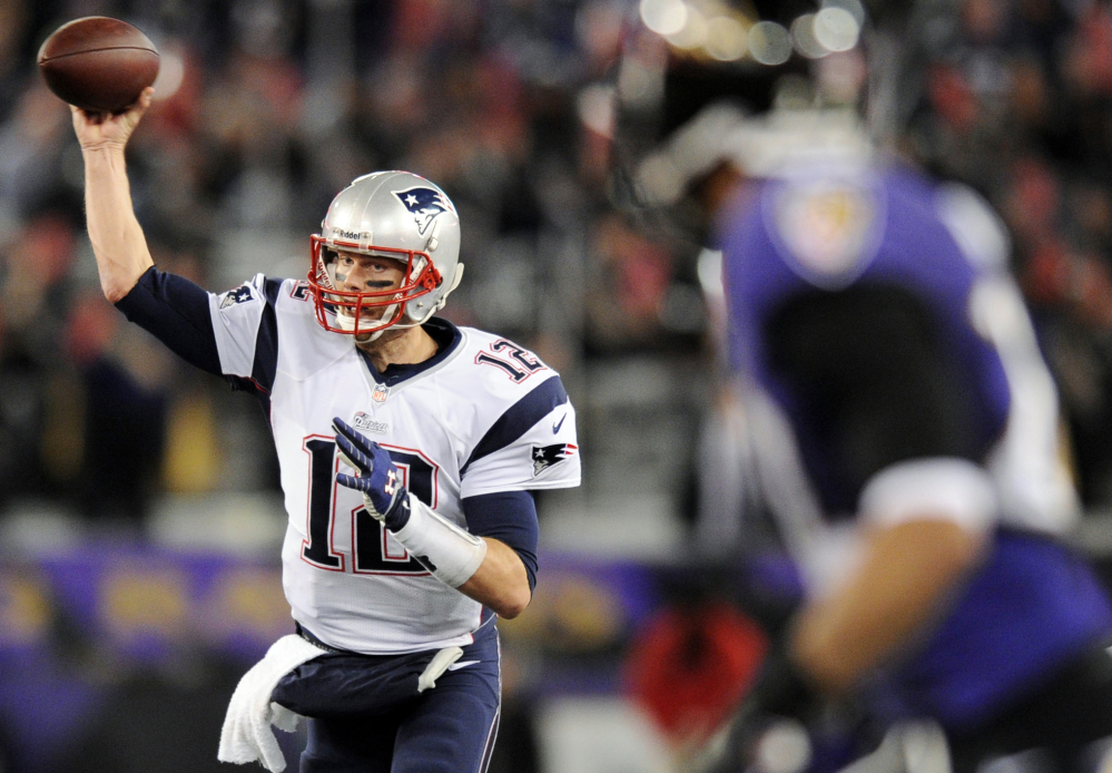 New England Patriots quarterback Tom Brady throws to a receiver in the second half of an NFL football game against the Baltimore Ravens, Sunday, Dec. 22, 2013, in Baltimore. (AP Photo/Nick Wass)