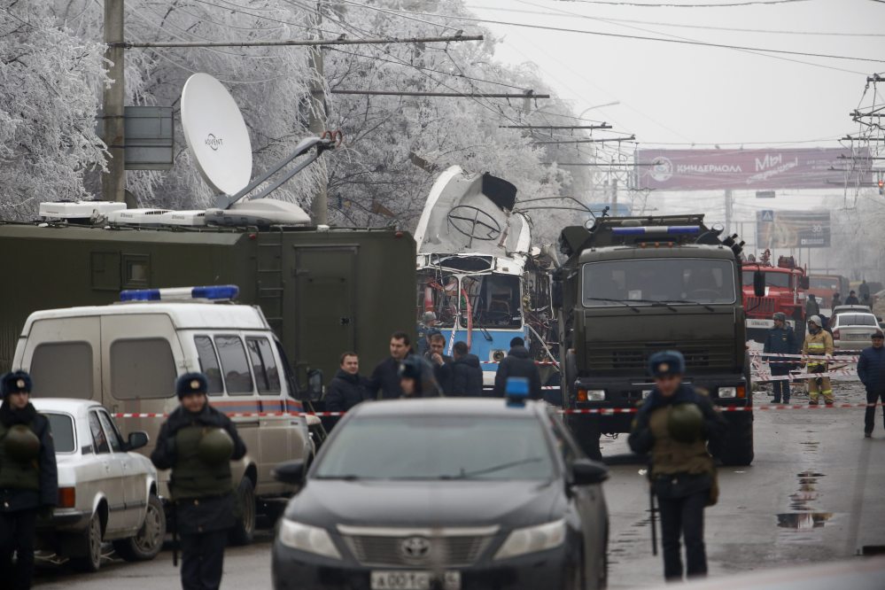 Military vehicles surround a wreckage of a trolleybus, in Volgograd, Russia, Monday.