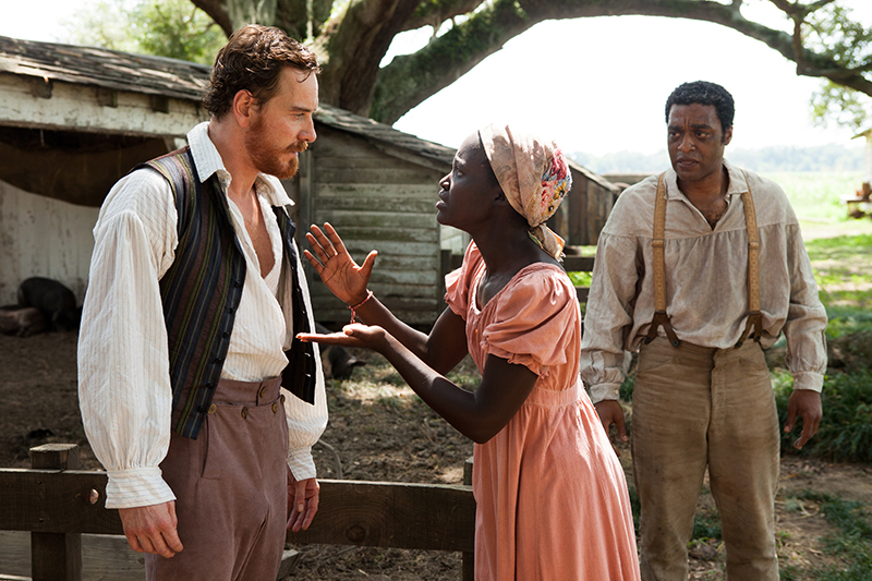 This image released by Fox Searchlight shows Michael Fassbender, left, Lupita Nyong'o and Chiwetel Ejiofor, right, in a scene from "12 Years A Slave." Fassbender was nominated for a Golden Globe for best supporting actor in a motion picture, Nyong'o was nominated for best supporting actress in a motion picture and Ejiofor was nominated for best actor in a motion picture drama for their roles in the film on Thursday, Dec. 12, 2013. The film was also nominated for best drama. The 71st annual Golden Globes will air on Sunday, Jan. 12.(AP Photo/Fox Searchlight, Francois Duhamel)