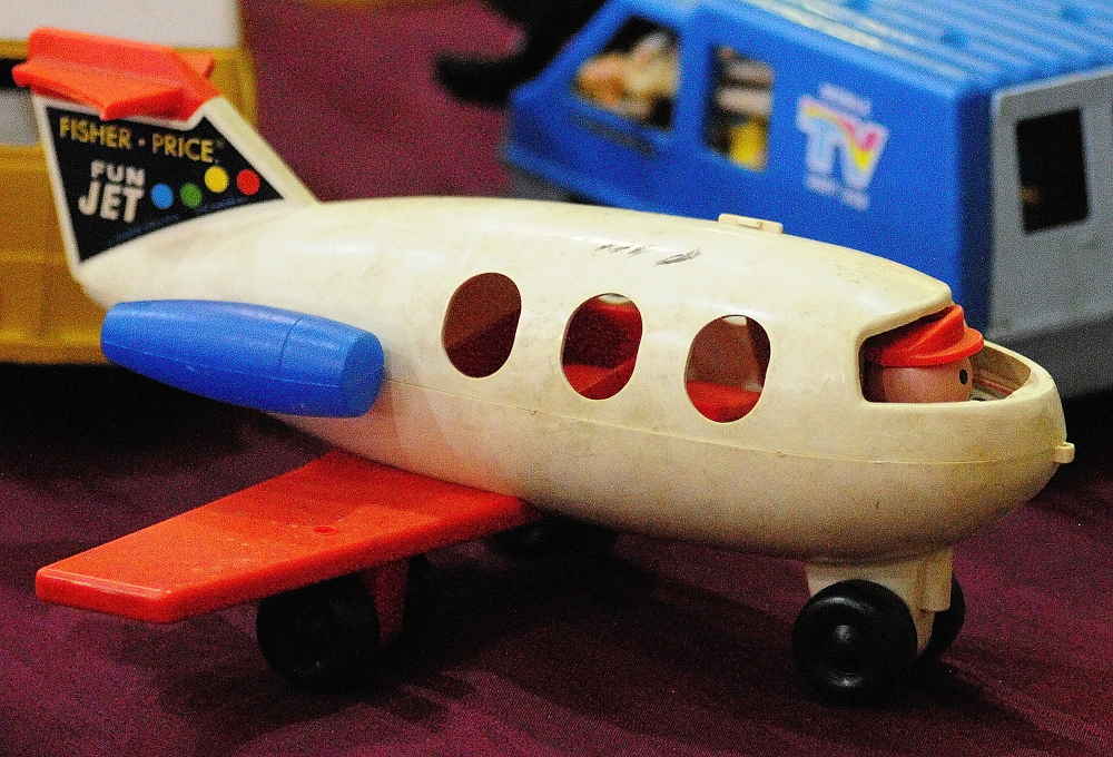 CHILD’S PLAY: This Fischer-Price Fun Jet and other toys were among the items on display Wednesday during the New Year’s Antiques Show at the Augusta State Armory.