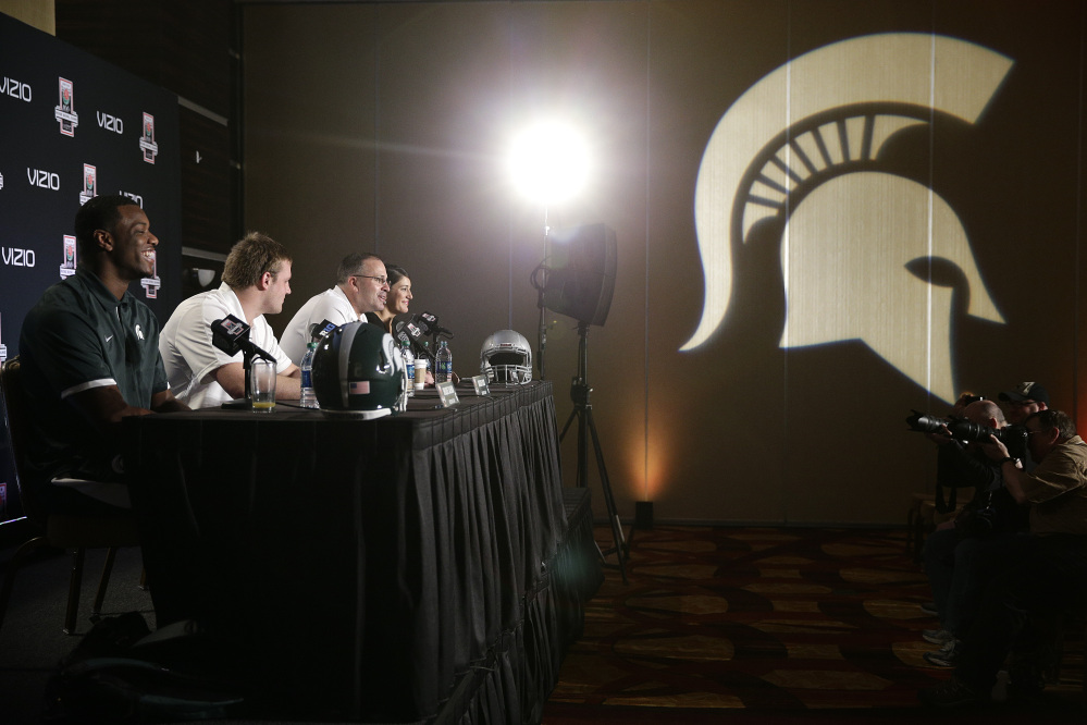 Michigan State defensive end Shilique Calhoun, from left, defensive end Marcus Rush and defensive coordinator Pat Narduzzi attend a news conference on Friday.