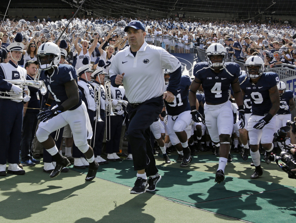Penn State coach Bill O’ Brien leads his team onto the field at Beaver Stadium for an NCAA college football game against Eastern Michigan in State College, Pa., in September.