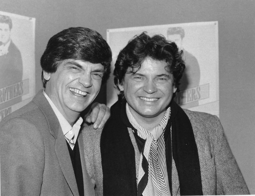 Phil, left, and Don Everly of the Everly Brothers joke around for photographers on Jan. 4, 1984, in New York City.