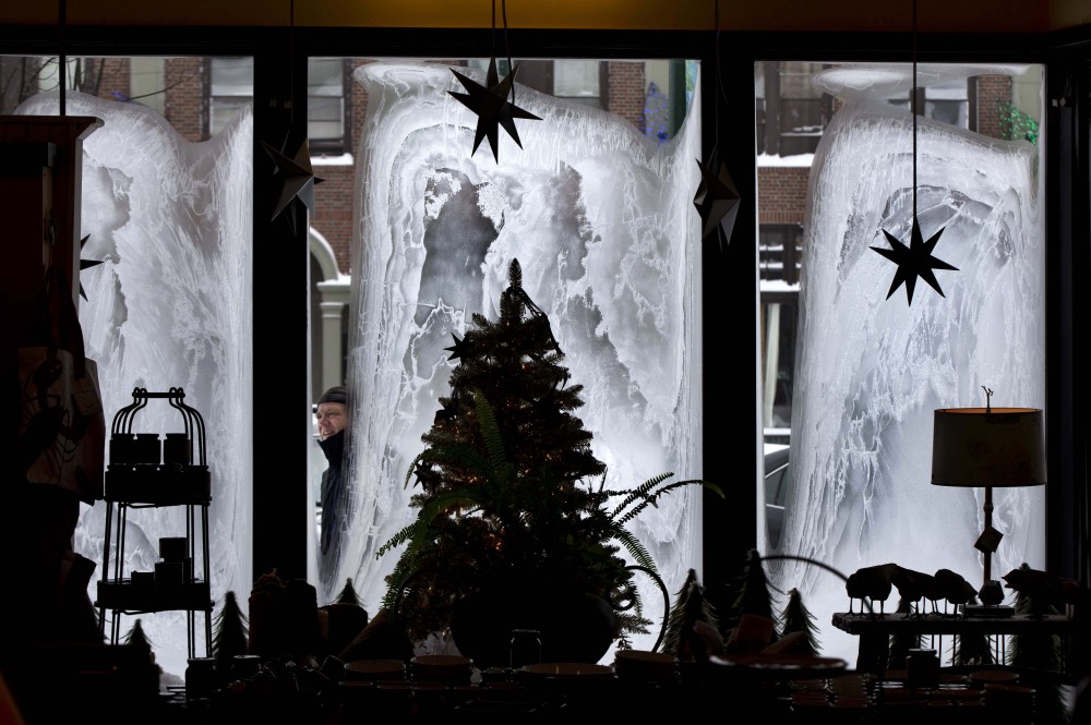 With the temperature hovering around zero degrees, John Faulkner checks on the frosty windows of his eclectic home furnishing store, Nest, on Friday in Brunswick. “We haven’t seen frost like this before,” said Faulkner. “It’s like living in a refrigerator.”