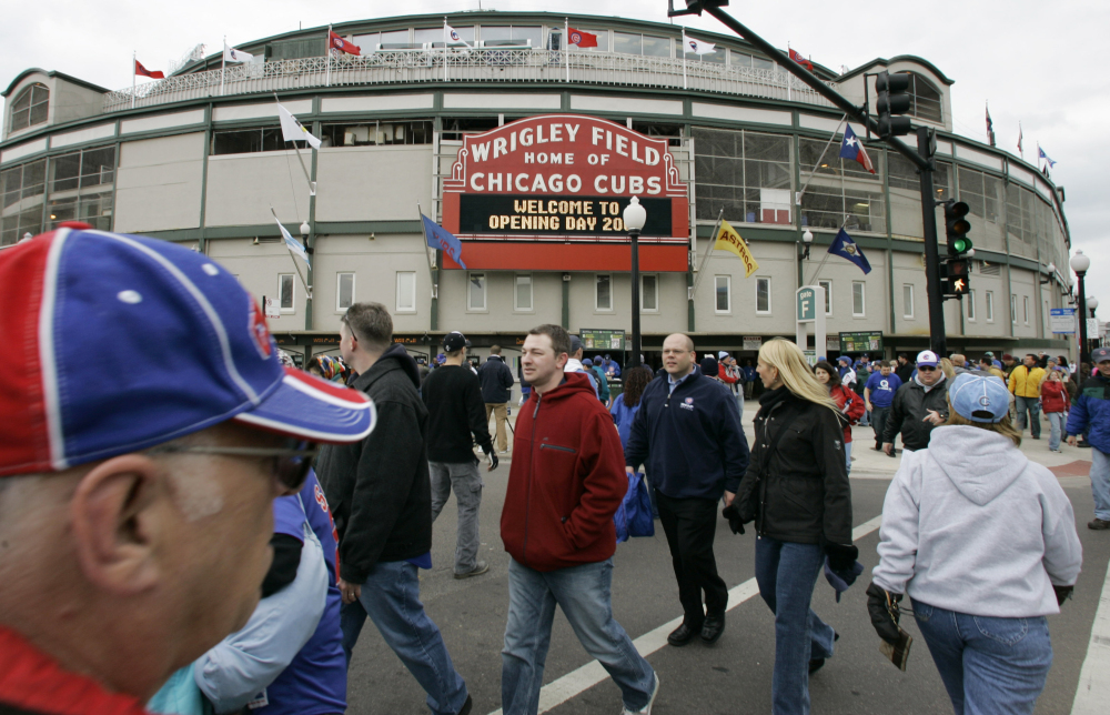 Chicago Cubs fans gather on an opening day outside Wrigley Field in Chicago. AP Photo