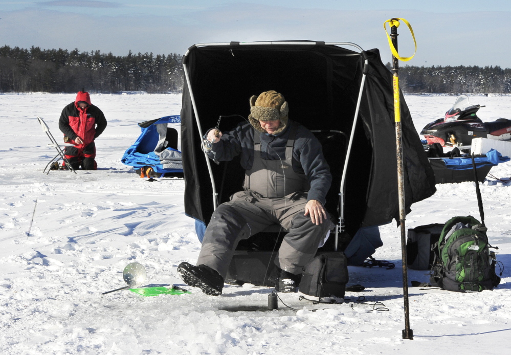 Steve Howland of South Portland and Steve McDougall of Portland jig for togue Saturday at Lower Bay on Sebago Lake.