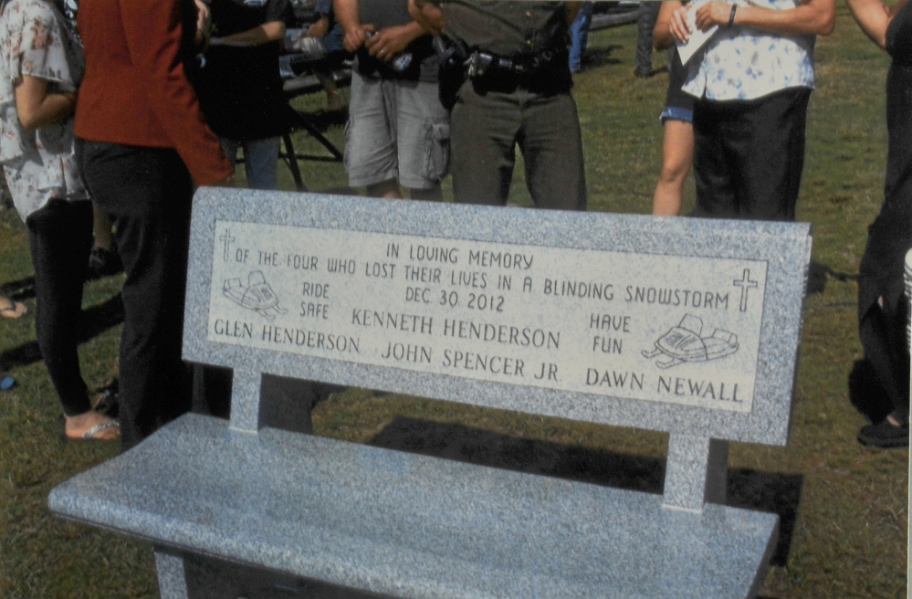 MEMORIAL: Relatives of the snowmobilers killed in Rangeley Lake donated a granite bench in their memory as well as to those who worked tirelessly to find them. The bench was placed in the Rangeley Lakes Chamber of Commerce park, near the lake, and dedicated Sept. 1.