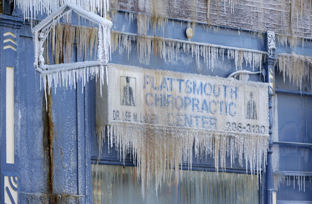 The Plattsmouth Chiropractic Center is decorated with icicles, after an adjacent building caught on fire in Plattsmouth, Neb., on Friday, and firefighters sprayed it with water.