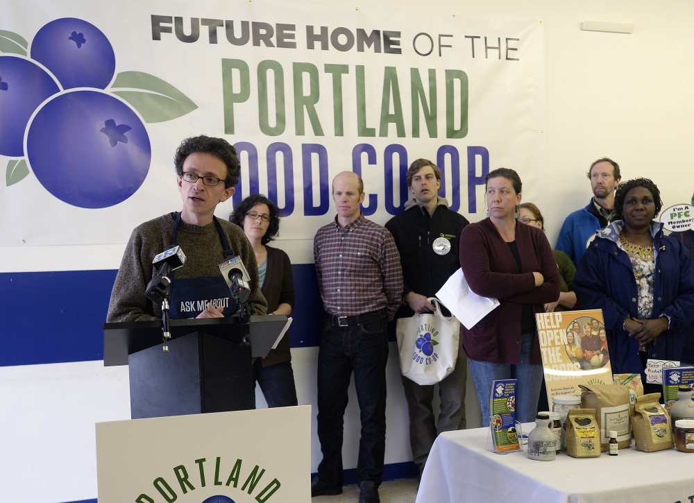 Portland Food Co-op President Daniel Ungier speaks during a news conference at the new storefront location for a full-service grocery store at 290 Congress St. in Portland on Monday.