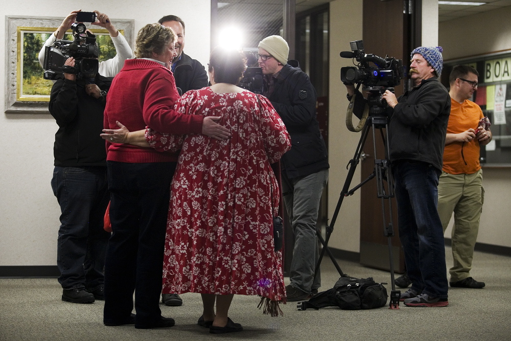 Cheryl Haws, left, and her partner Shelly Eyre hold each other while being interviewed by the media after their marriage license issued at the Utah County Clerk’s office in Provo, Utah, in December. The U.S. Supreme Court put a hold on gay marriage in Utah.