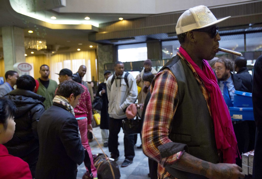 Former NBA basketball star Dennis Rodman and fellow U.S. basketball players arrive at a hotel in Pyongyang, North Korea on Monday.