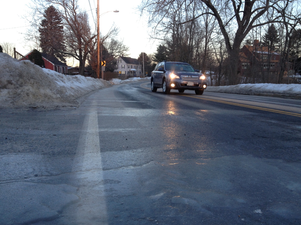 Large patches of ice make travel on Capisic Street dangerous for early morning travelers.