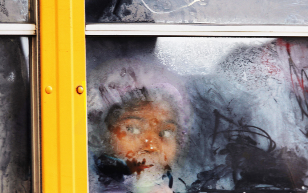 A student looks out the frosted window of a school bus as it moves down 19th Street, Tuesday, Jan. 7, 2014 in Philadelphia. The record-breaking polar air that has made the Midwest shiver over the past few days spread to the East and South on Tuesday, sending the mercury plunging into the single digits and teens from Boston and New York to Atlanta, Birmingham, Nashville and Little Rock _ places where many people don’t know the first thing about extreme cold.