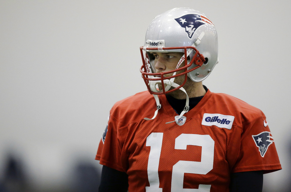 New England Patriots quarterback Tom Brady pauses during a stretching session before practice Tuesday at the team’s facility in Foxborough, Mass. The Patriots are scheduled to host the Indianapolis Colts in an NFL divisional playoff game on Saturday.