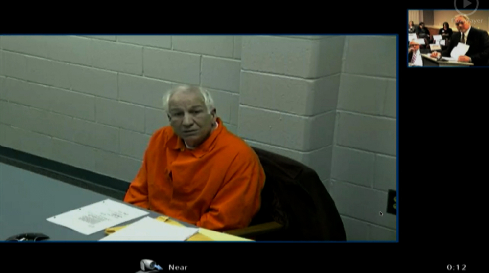 This video framegrab provided by the courthouse pool via Commonwealth Media Services shows Jerry Sandusky describing his career and retirement from Penn State by video link from Greene State Prison in southwestern Pennsylvania, Tuesday, as testimony began in a hearing into whether he can get back the retirement benefits he lost after being convicted of child molestation.