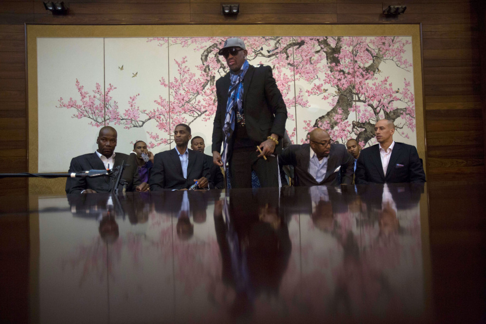 Dennis Rodman stands up to leave after he and fellow US basketball players completed a television interview at a Pyongyang, North Korea hotel Tuesday.