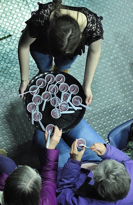 AG SHOW: Elizabeth Simonds, top, passes out blueberry kale smoothies that her mother Cynthia Finnemore Simonds, of Mindful Mouthful, made during a cooking demonstration at the Maine Agricultural Trades Show on Wednesday at the Augusta Civic Center.