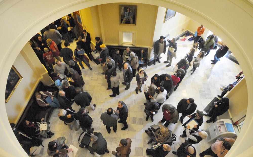 The third-floor hallway between the House and Senate chambers is crowded with people who were part of a large group attending a State House rally in Augusta on Wednesday to support Medicaid expansion as this year’s legislative session kicked off.