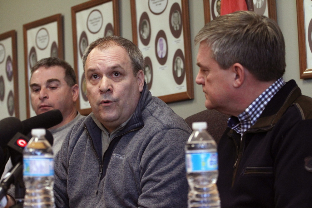 Canadian National Railway CEO Claude Mongeau, center, and New Brunswick Premier David Alward answer questions about the train derailment at a news conference in Plaster Rock on Wednesday. Mongeau sa that of the 17 cars that derailed in, five contain crude oil and four contain propane.