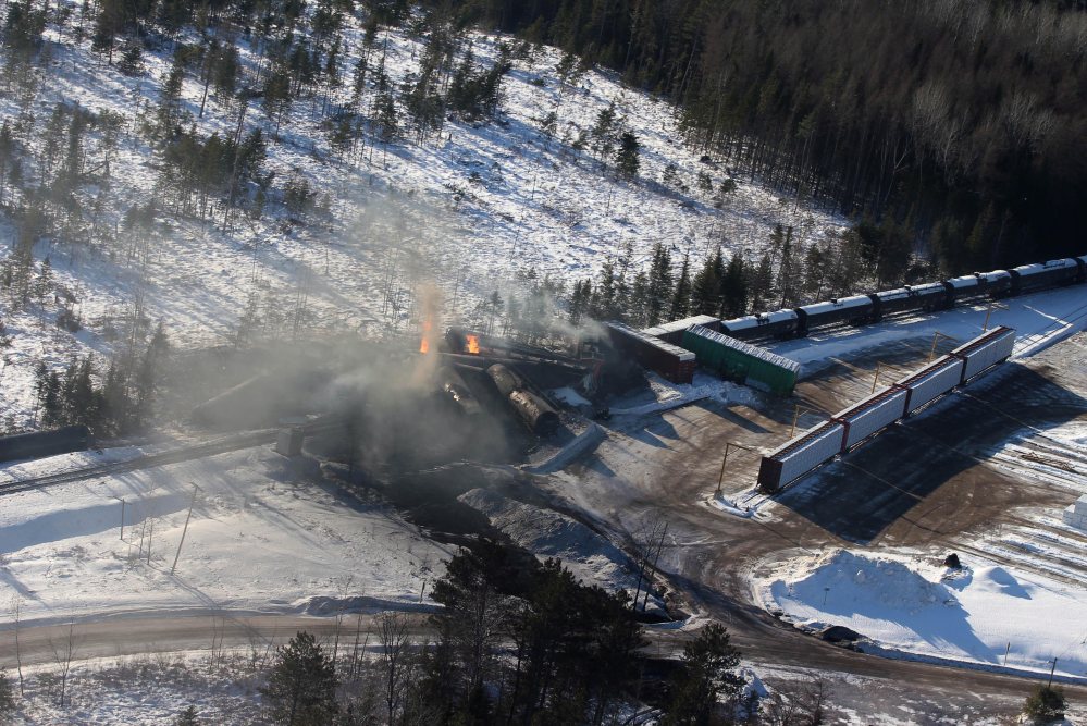 This aerial photo shows derailed Canadian National Railway cars burning in Plaster Rock, New Brunswick, on Wednesday.