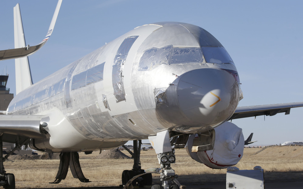 A retired American Airlines jet is parked in Roswell, New Mexico. The decision to scrap old planes and buy new ones is being driven by high fuel prices, low interest rates and Wall Street financing mechanisms that allow airlines with junk bond ratings to borrow money at favorable terms.