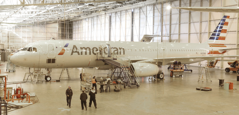 A new plane is prepared for use at the American Airlines operations center hangar in Grapevine, Texas. American designed the interior of its new planes with the concept that “your life should never be interrupted because you are flying,” says Alice Liu, managing director for onboard products for the airline.