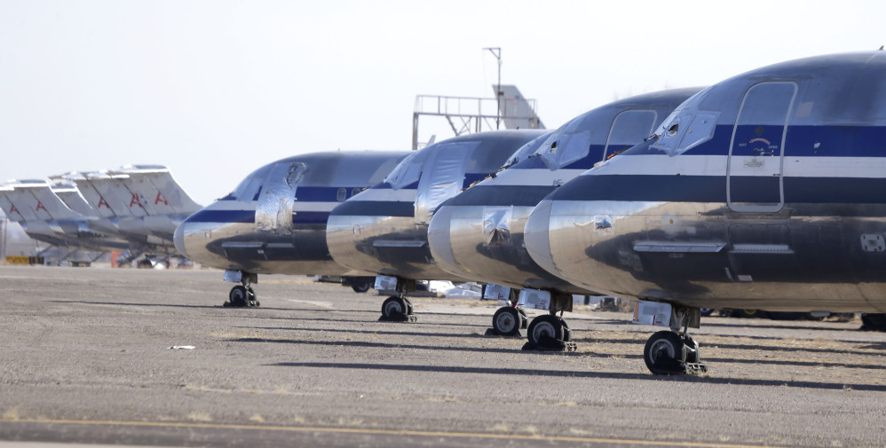 Retired airliners sit parked at the airport in Roswell, N.M. where the dry desert air prevents the aluminum airframe from corroding and spare parts can be harvested or the old jets get chopped up for scrap metal.