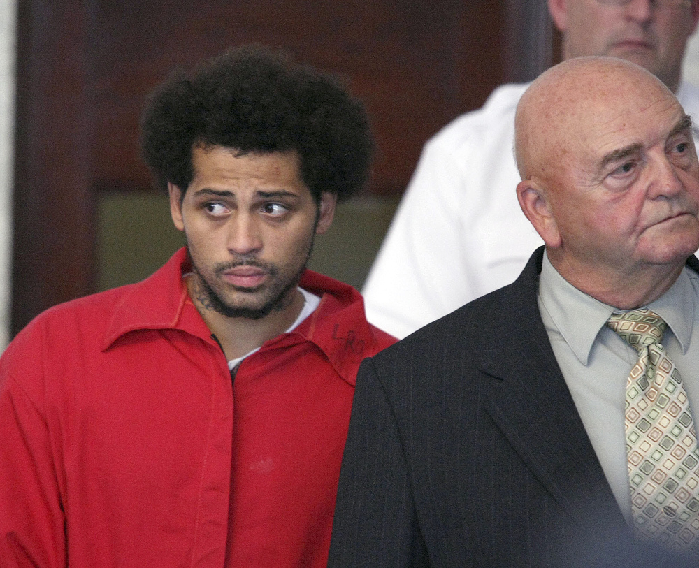 Carlos Ortiz, an associate of ex-New England Patriot Aaron Hernandez, enters the Attleboro District Court with attorney John Connors for his arraignment on weapons charges, in Attleboro, Mass., in this June 28, 2013 photo.