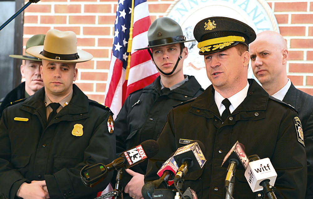 Pennsylvania State Police Capt. Steven Junkin, right, addresses the media Friday at the Chambersburg barracks in Pennsylvania. Junkin gave few new details of the investigation of the recent Interstate 81 killing of a Mainer.