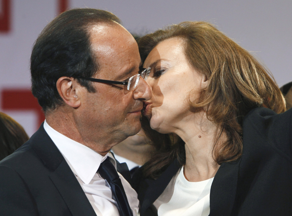 French president-elect Francois Hollande kisses his companion, Valerie Trierweiler, after greeting crowds gathered to celebrate his election victory in Bastille Square in Paris in this May 6, 2012, photo.