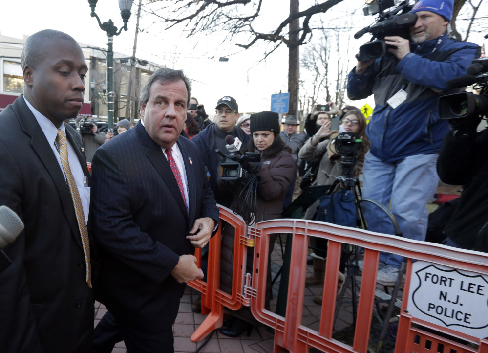 New Jersey Gov. Chris Christie, second left, arrives at Fort Lee, N.J., City Hall on Jan. 9. Christie traveled to Fort Lee to apologize in person to Mayor Mark Sokolich.