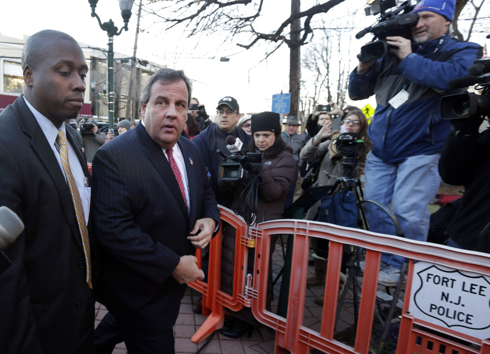 New Jersey Gov. Chris Christie, second left, arrives at Fort Lee, N.J., City Hall on Thursday, where he apologized in person to Mayor Mark Sokolich for the closure of two entrances to the George Washington Bridge that snarled traffic in September.