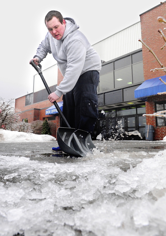 ice work: Jeremy Beeney scrapes ice off the sidewalk Saturday in front of the Augusta Civic Center in the aftermath of an early morning freezing rainstorm. Beeney and the other civic center maintenance workers were busy keeping roads and walks clear for the people attending the Northeast Motorsports Show that runs through Sunday.