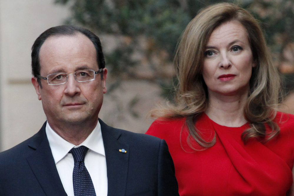 French President Francois Hollande, left, and his companion Valerie Trierweiler, who has been hospitalized after a report that the president is having an affair with an actress.