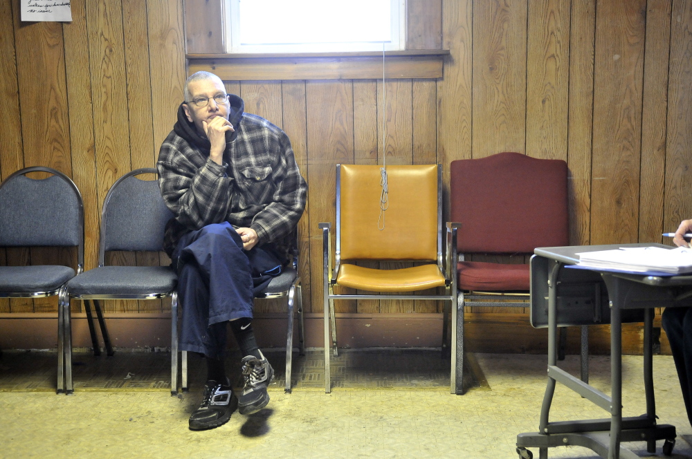Waiting: Joe Lessard, 49, of Benton, waits for his order to be filled at the food pantry at the First Baptist Church in Fairfield on Thursday. Lessard is picking up an order for seven people.