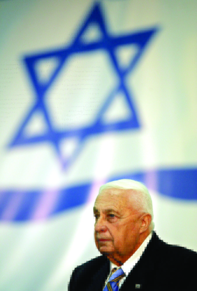 FILE - In this file photo taken Sunday Sept. 25, 2005, Israeli Prime Minister Ariel Sharon attends a Likud Party Central Committee meeting in Tel Aviv. Prime Minister Ariel Sharon's leadership of the governing Likud party is to come up against a stiff challenge Sunday as the party's central committee meets to decide whether to back him or not. Following deliberations Sunday, the committee is to vote Monday on when to hold a party primary. (AP Photo/Ariel Schalit, File)