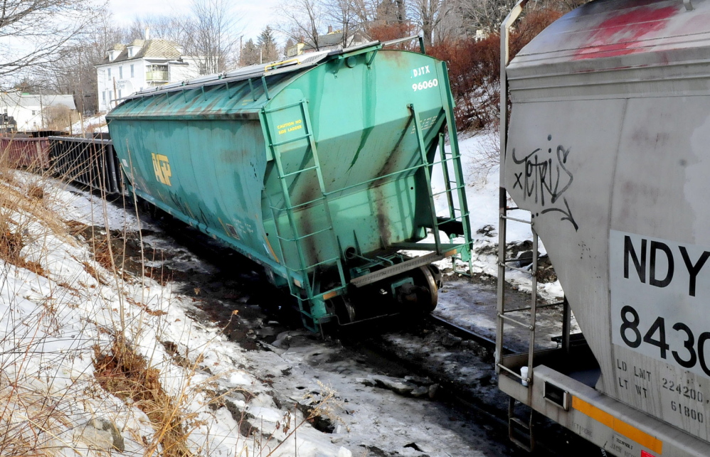 TWISTED RAIL: A railroad car is leaning to the side on a twisted rail along Bay Street in Winslow on Wednesday.