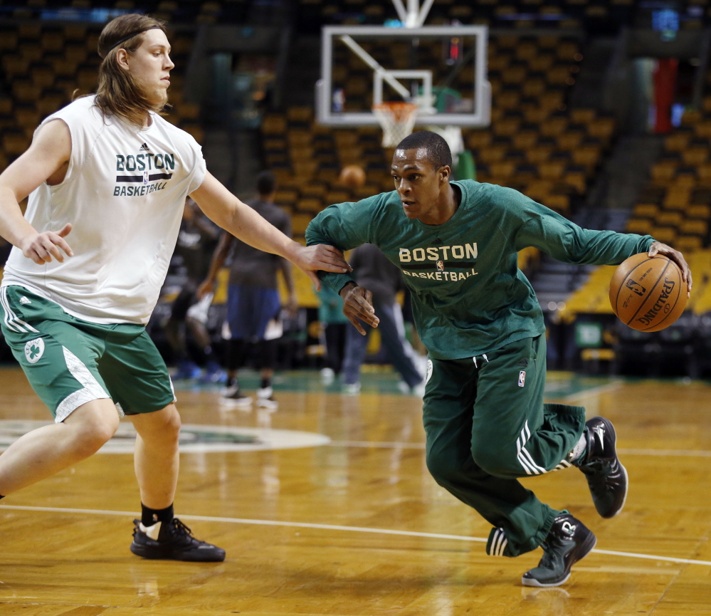 Boston Celtics’ Rajon Rondo, right, works out with teammate Kelly Olynyk in Boston last month. Rondo was assigned to work out with the Maine Red Claws on Wednesday as he recovers from a knee injury.