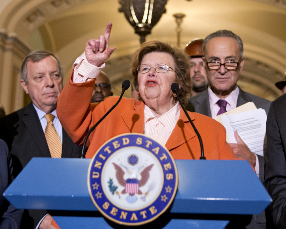 Senate Appropriations Committee Chairman Sen. Barbara Mikulski, D-Md., flanked by Senate Majority Whip Richard Durbin of Ill., left, and Sen. Charles Schumer, D-N.Y., was a chief author of the spending bill. “We met compelling human needs. We certainly preserved national security,” she said.