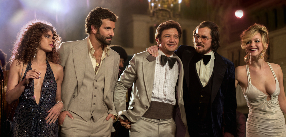 From left, Amy Adams, Bradley Cooper, Jeremy Renner, Christian Bale and Jennifer Lawrence appear in a scene from “American Hustle.” The film was nominated for 10 awards, including an Academy Award for best picture, on Thursday.
