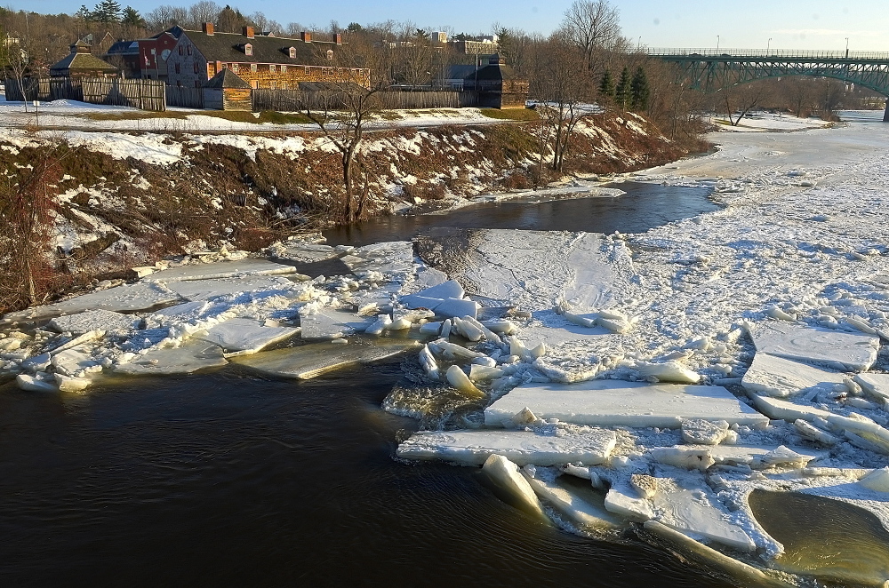 Staff photo by Joe Phelan Slabs of ice the Kennebec RIver in downtown Augusta can be seen piling up in a photo taken on Friday Jan. 17, 2014 from the Calumet Bridge at Old Fort Western in downtown Augusta.
