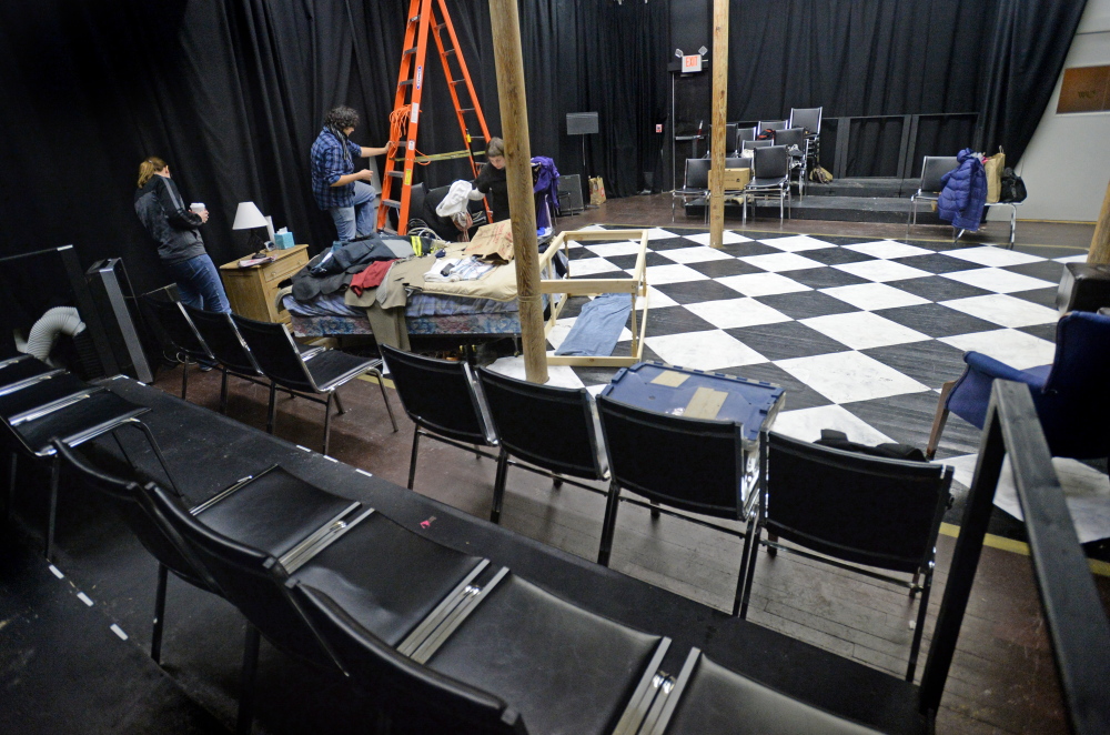 The cast and crew of the play “Vigils” set up prior to a rehearsal at Mad Horse Theater in South Portland. Mad Horse converted the space after Portland’s Lucid Theater went under.