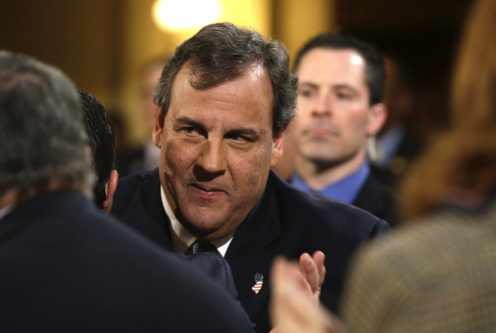 In this Tuesday, Jan. 14, 2014 file photo, New Jersey Gov. Chris Christie arrives to deliver his State Of The State address at the Statehouse in Trenton, N.J.