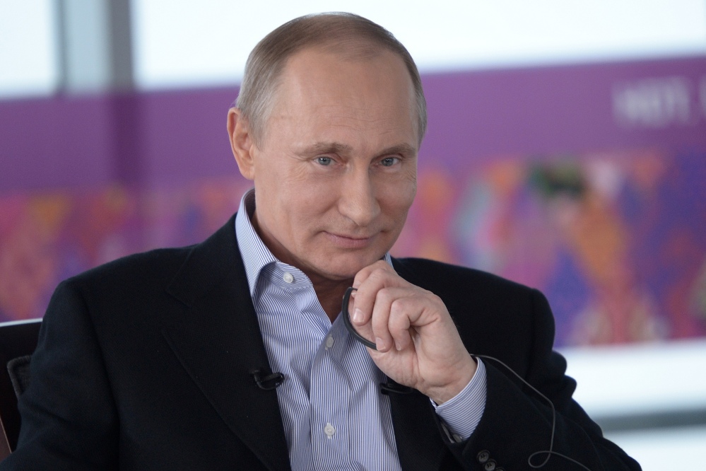 Russian President Vladimir Putin, listens during an interview Friday to Russian and foreign media at the Russian Black Sea resort of Sochi, which will host Winter Olympic Games on Feb. 7, 2014.