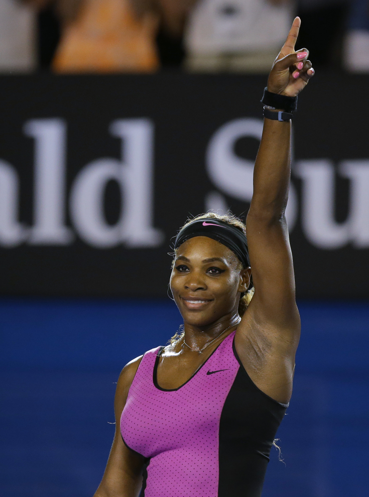 Serena Williams of the United States celebrates after defeating Ashleigh Barty of Australia in their first round match at the Australian Open tennis championship in Melbourne, Australia, Monday, Jan. 13, 2014.(AP Photo/Aaron Favila)