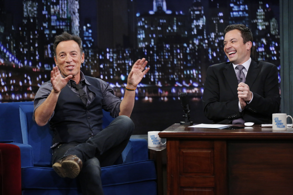 This image released by NBC shows Bruce Springsteen, left, with host Jimmy Fallon during an recent appearance on “Late Night with Jimmy Fallon.”