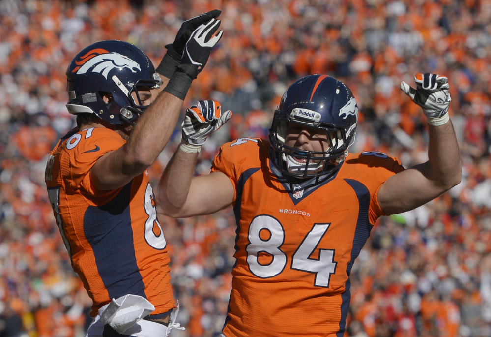 Broncos tight end Jacob Tamme celebrates his touchdown with Eric Decker in the first half of Sunday’s AFC championship game against the New England Patriots at Denver.