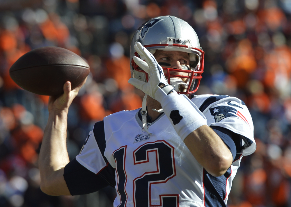 Patriots quarterback Tom Brady warms up before Sunday’s AFC championship at Denver.