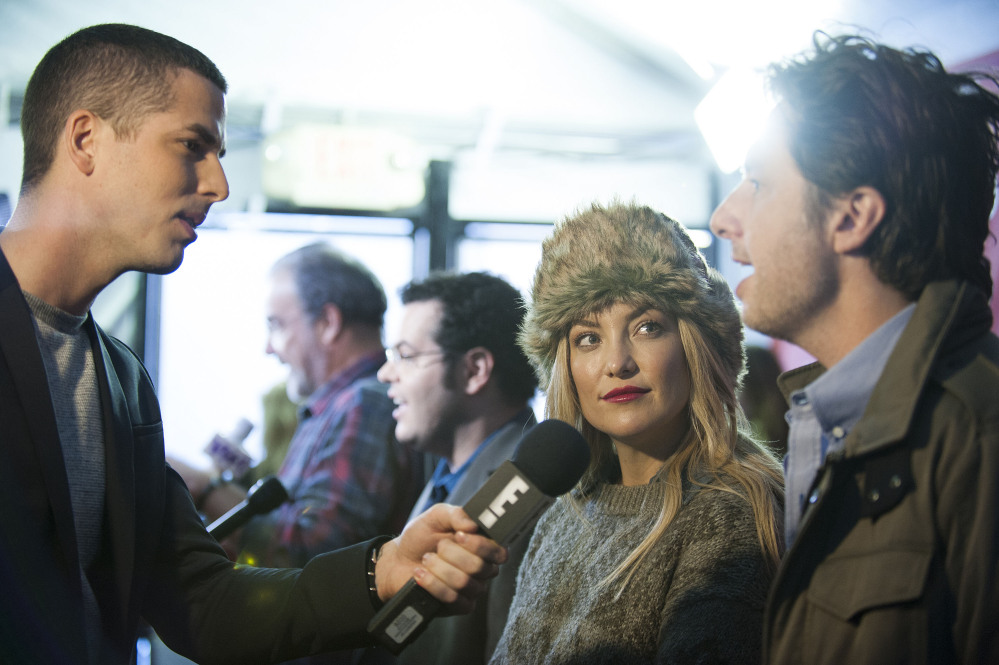 Actress Kate Hudson looks up at director/co-writer Zach Braff as they are being interviewed at the premiere of the film “Wish I Was Here” during the 2014 Sundance Film Festival on Saturday in Park City, Utah.